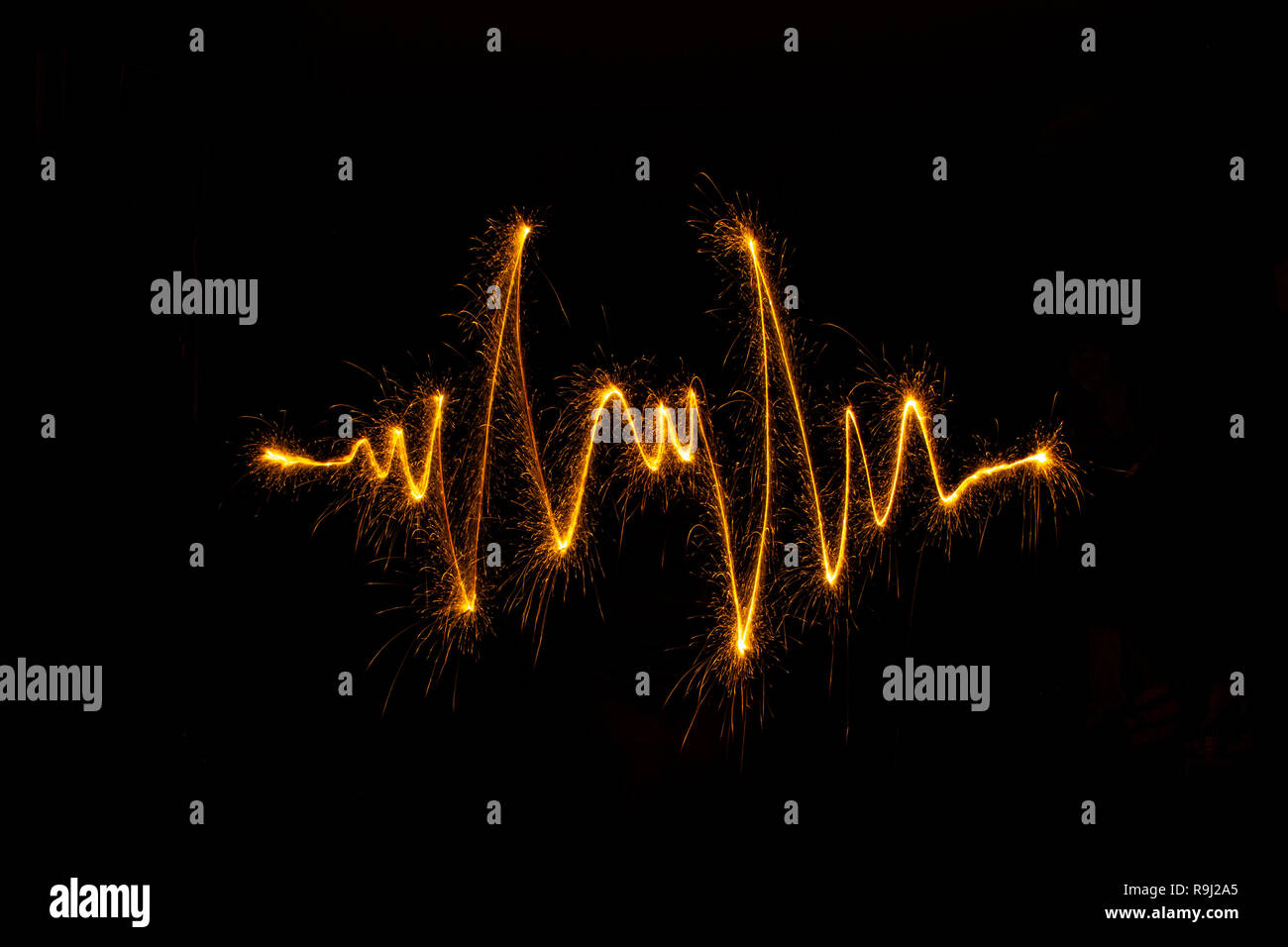 Abstract sparkler firework light on black background. Long exposure pattern Stock Photo