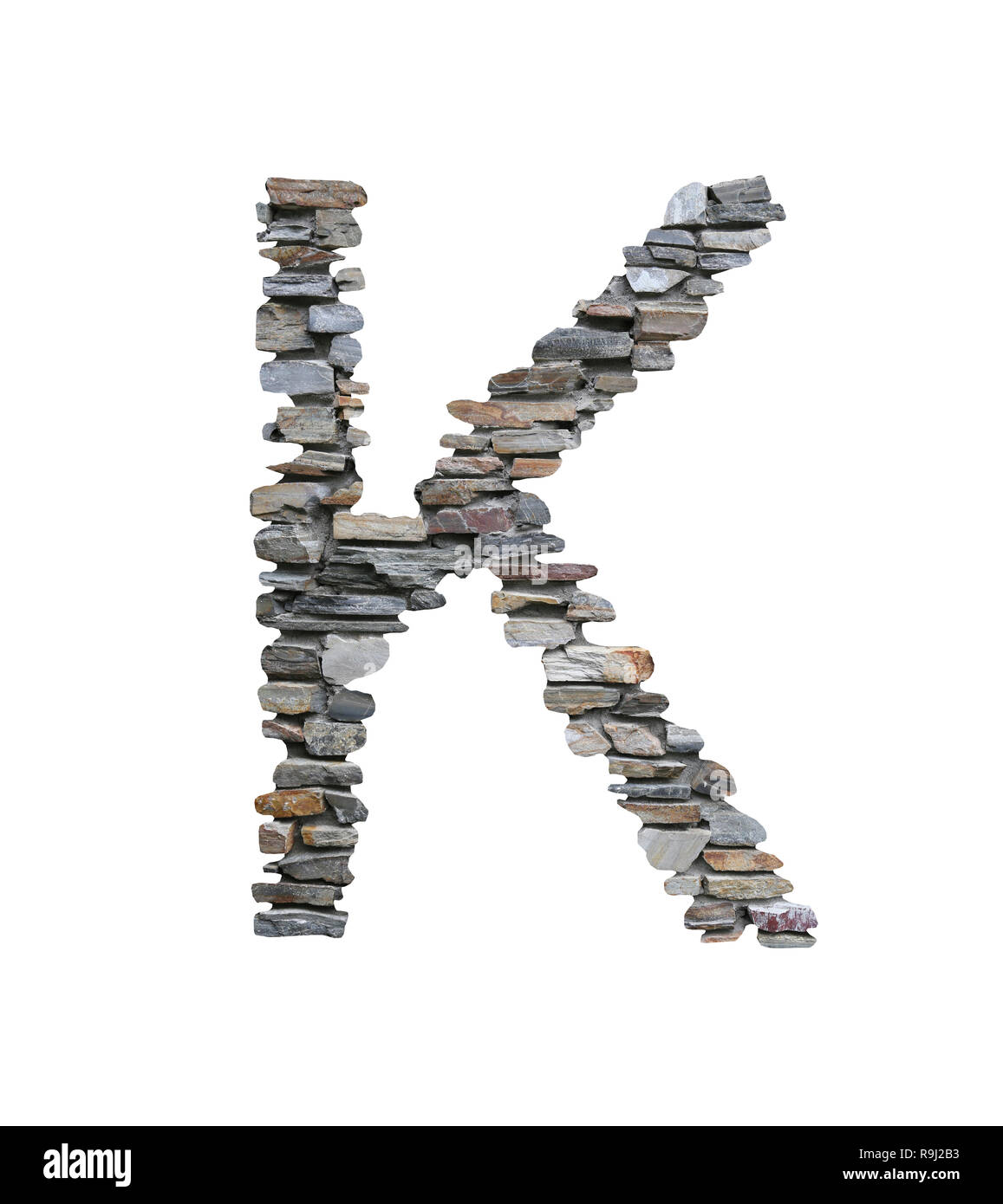Font of K to create from stone wall isolated on white background with clipping paths. Stock Photo