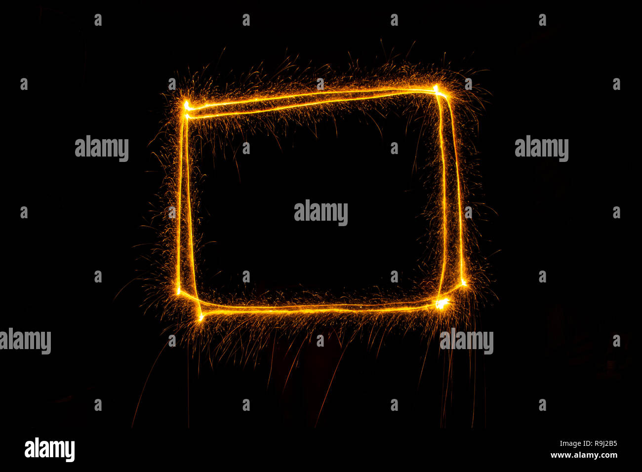 Abstract sparkler firework light on black background. Long exposure pattern Stock Photo