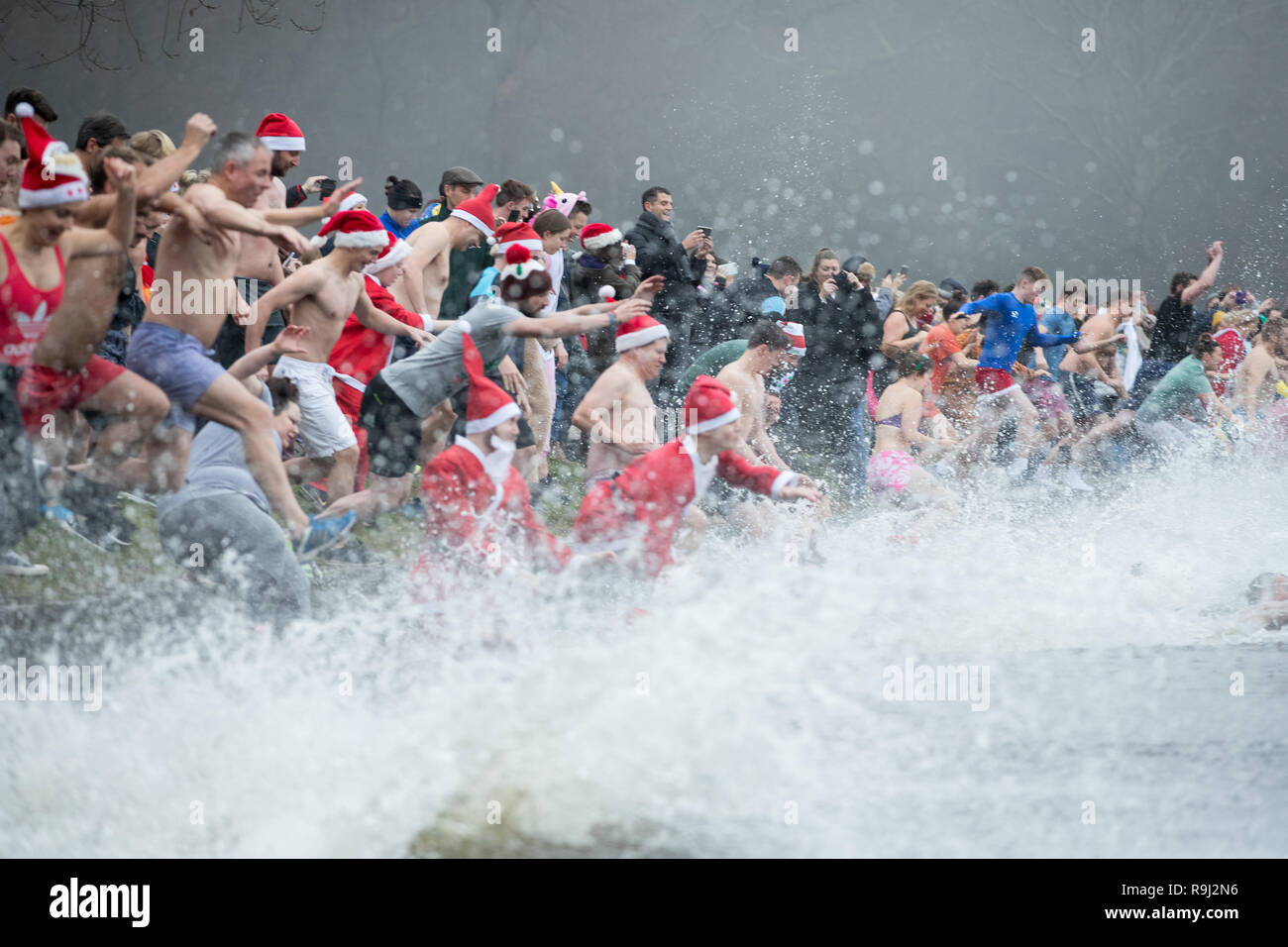 People take a Christmas day swim in Blackroot Pool at Sutton Park in