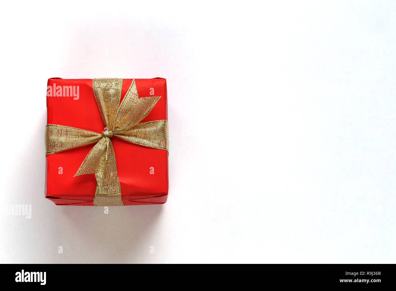 Red gift box isolated on white with close-up for design in Christmas ...