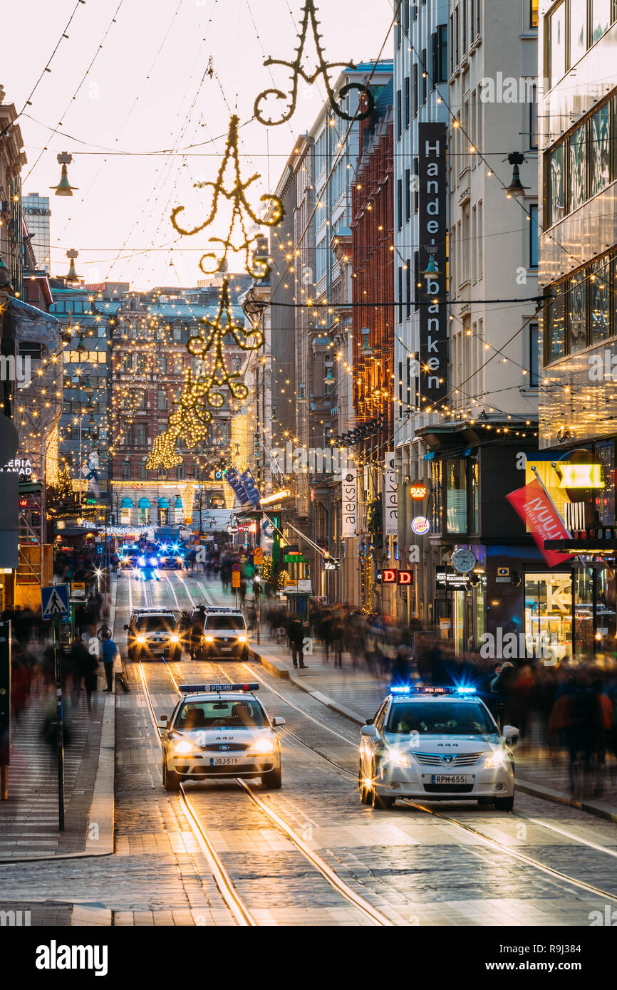 Helsinki, Finland - December 6, 2016: Police Provide Security On Aleksanterinkatu Street. Festive Illuminations View Of Aleksanterinkatu Street During Stock Photo