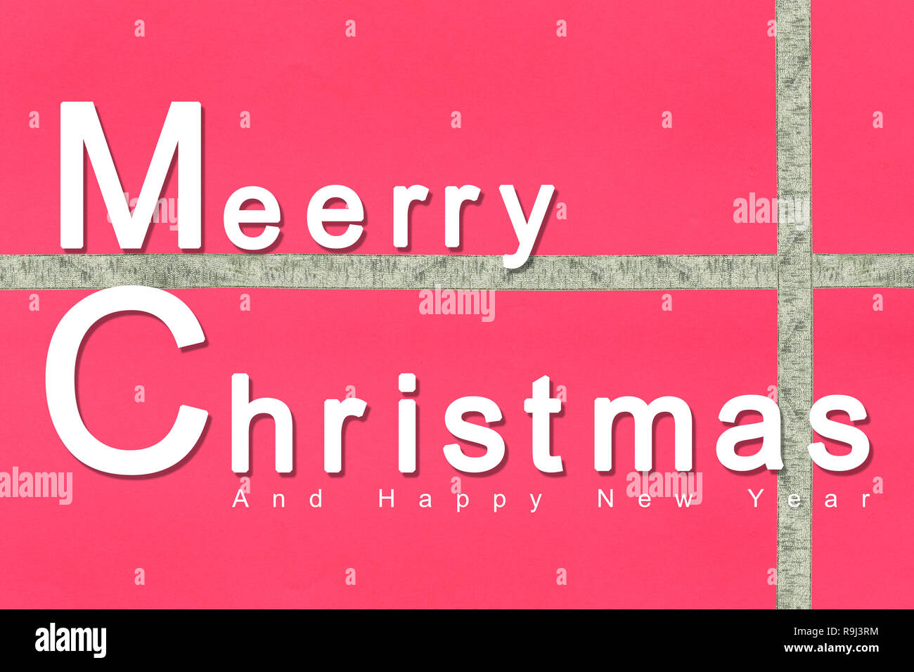 Merry Christmas text design on red surface paper background for design in your work. Stock Photo