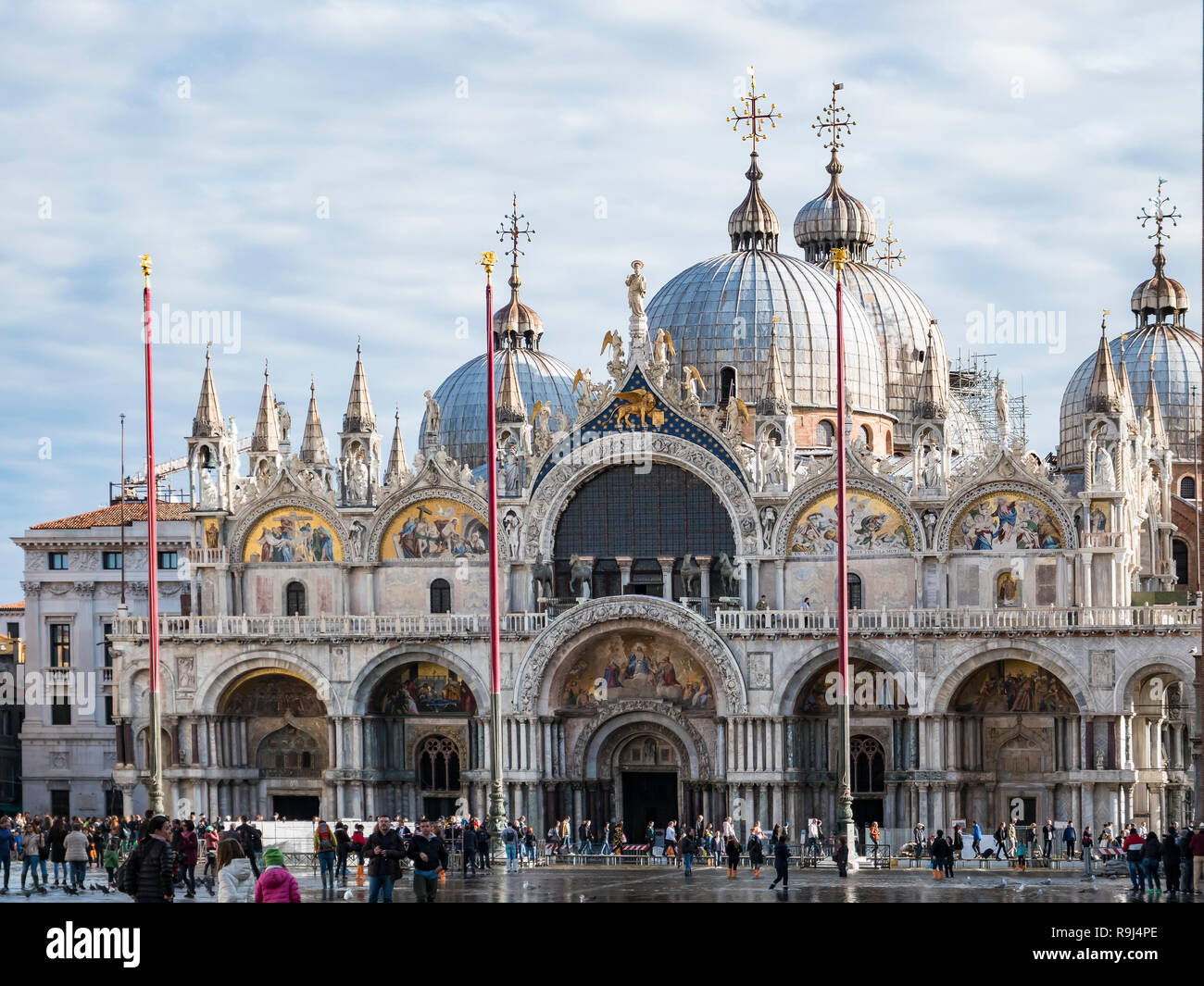 VENICE, ITALY, NOV 1st 2018: Saint Mark's or San Marco Cathedral or Basilica Domes and Bell Tower. Ancient renaissance italian or venetian architecture. Vivid color. People Stock Photo