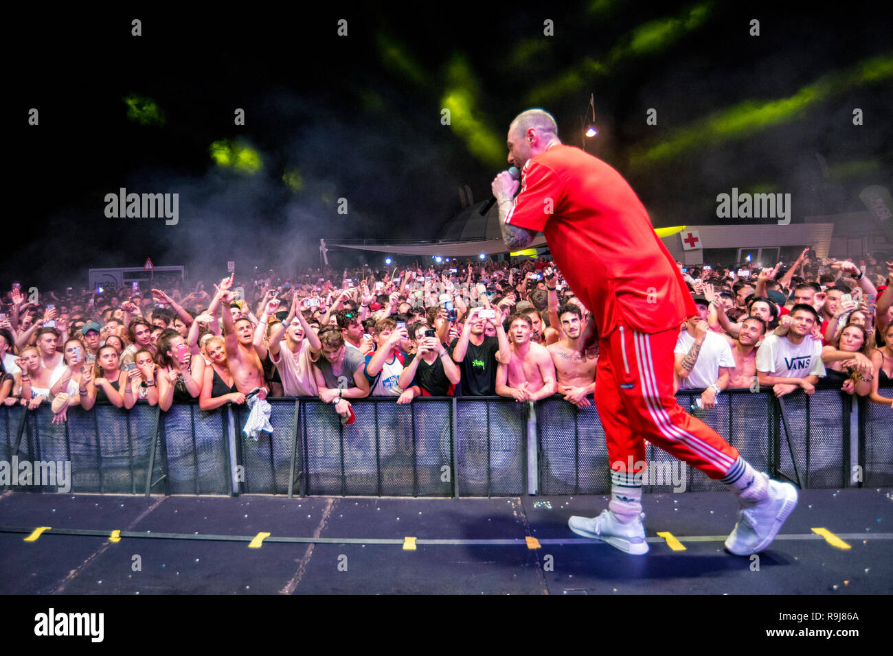 RIMINI, ITALIA - JUNE 24, 2017: Molo Street Parade Rimini, the Italian singer Fabri Fibra performs live singing his greatest hits. Stock Photo