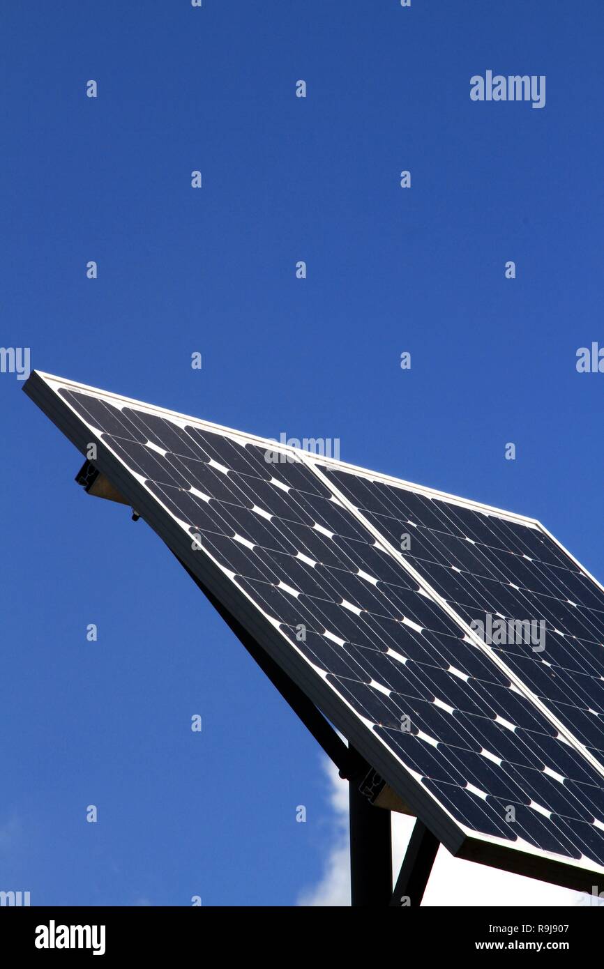 solar panels on house roof top with blue sky generating electrical power for the customer no people stock images stock photo Stock Photo