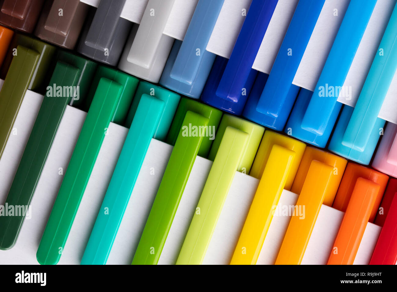 Multi-colored markers in white packaging, laid on the diagonal, positive learning Stock Photo
