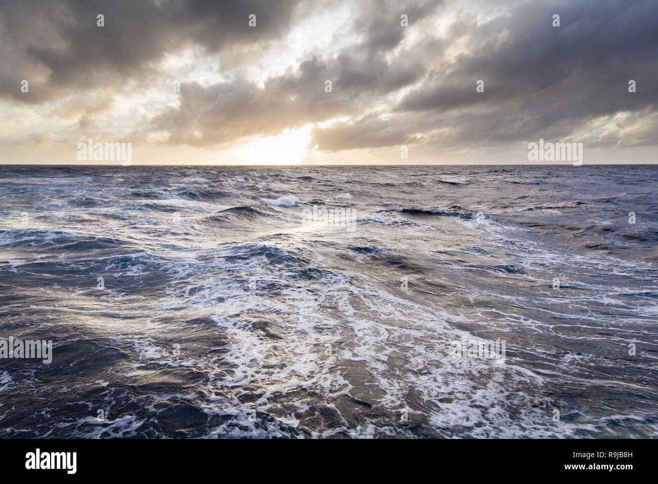 Ship cruising at stormy seas in the Southern ocean Stock Photo