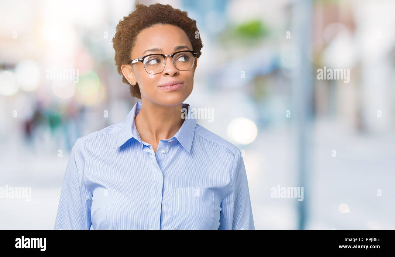 Young beautiful african american business woman over isolated ...