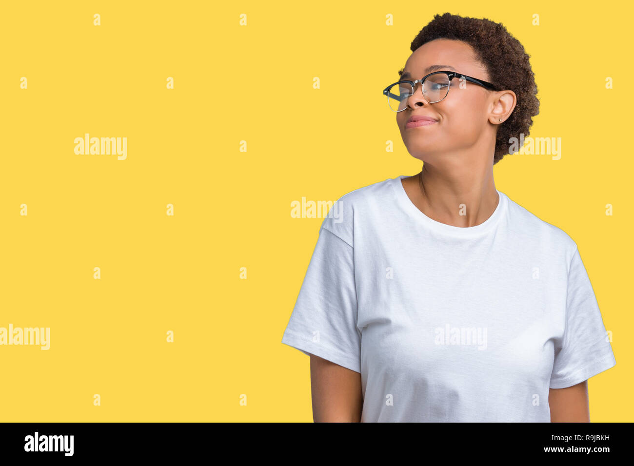 Beautiful young african american woman wearing glasses over isolated ...