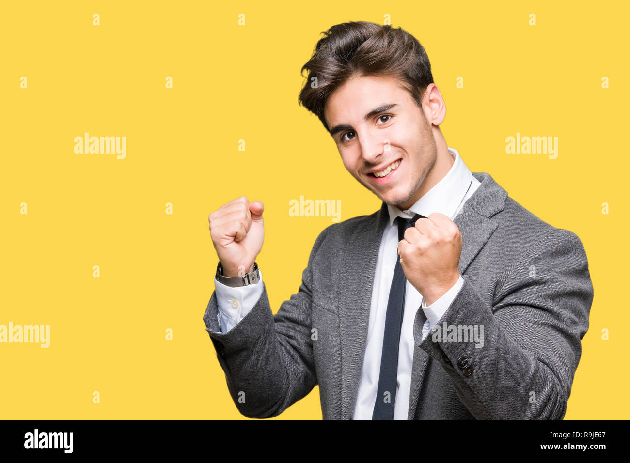 Young business man wearing suit and tie over isolated background very ...