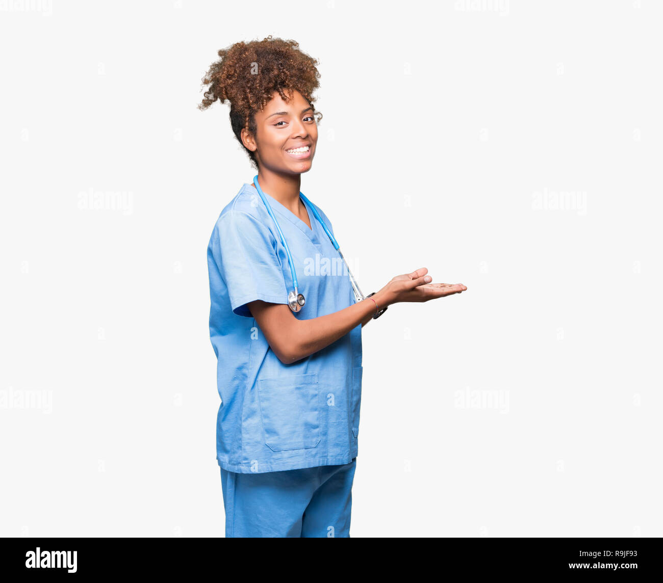 Young African American Doctor Woman Over Isolated Background Pointing To The Side With Hand And 3773