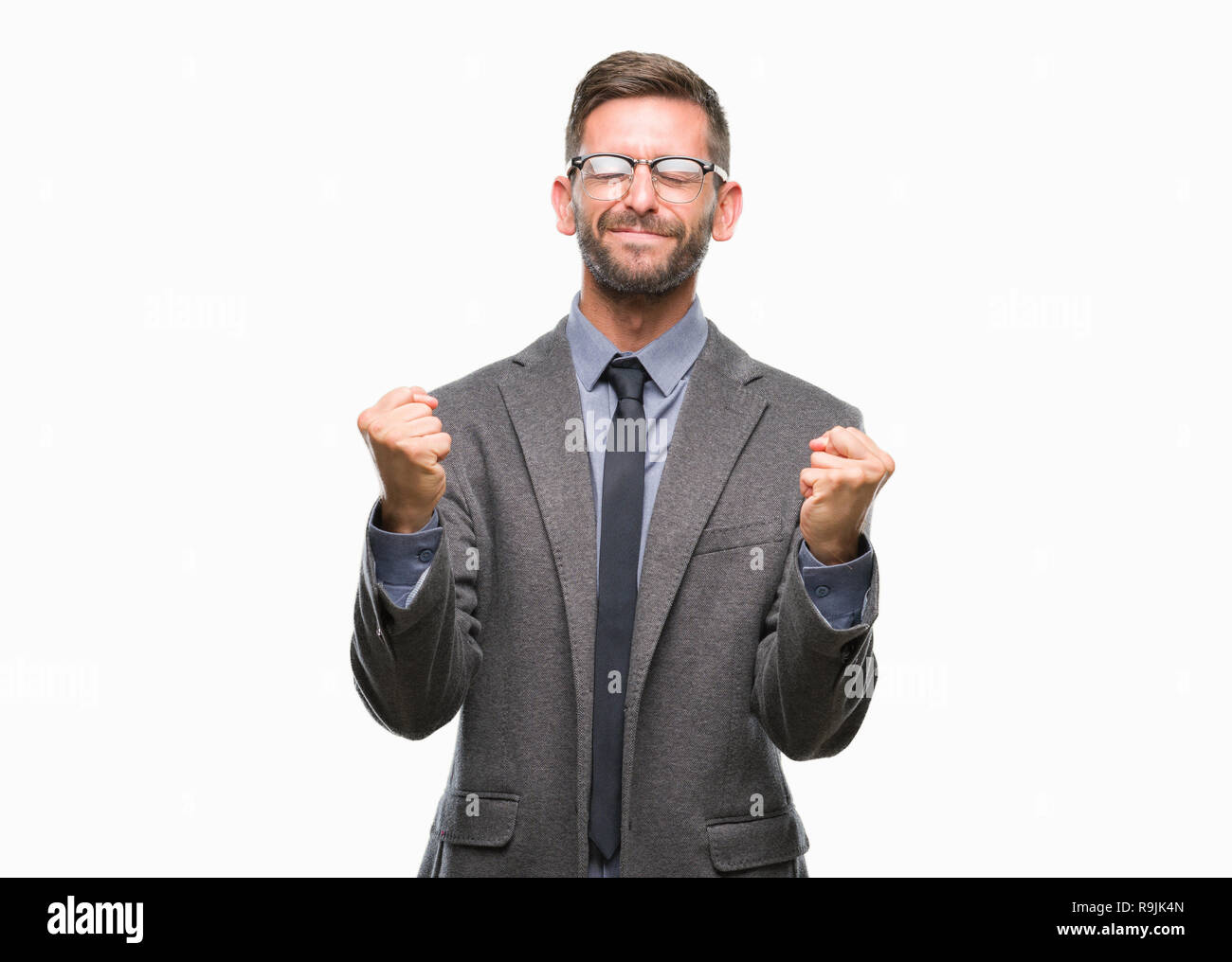 Young handsome business man over isolated background very happy and ...
