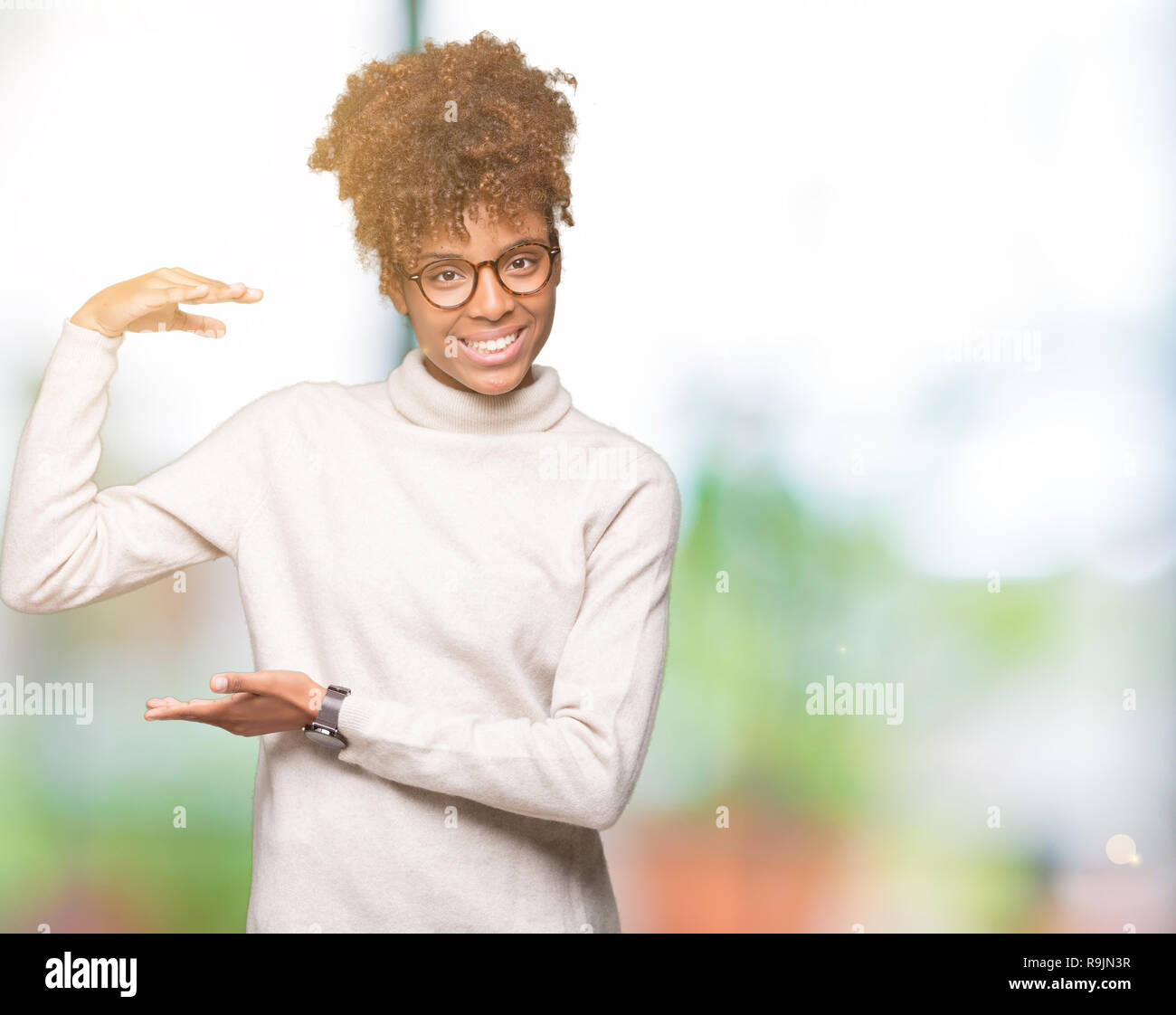 Beautiful young african american woman wearing glasses over isolated ...