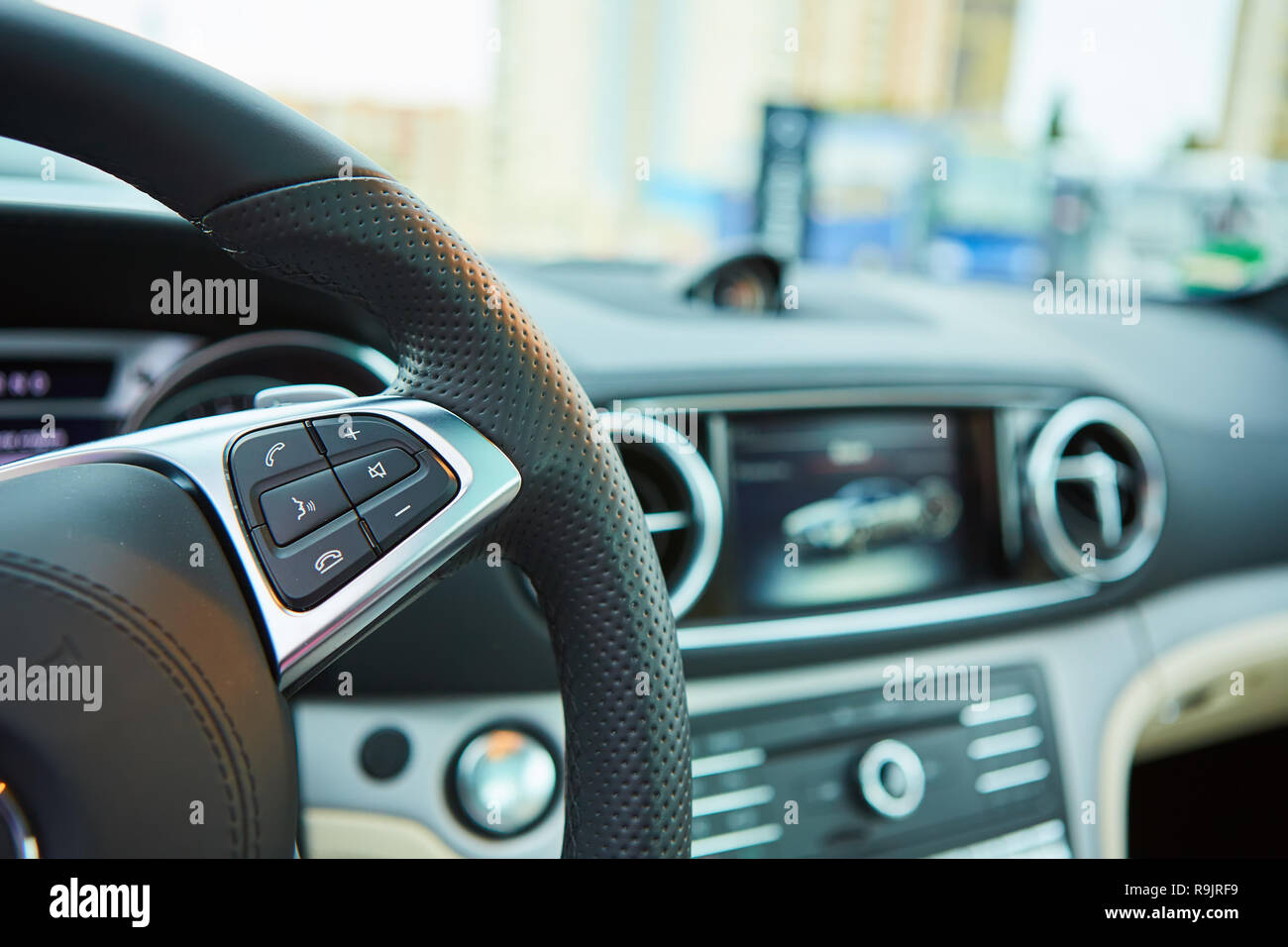 Control buttons on the steering wheel of a car Stock Photo Alamy