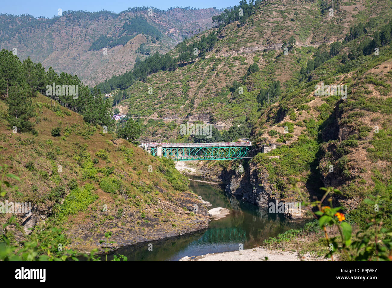 Aerial view of mountain river valley with bridge and mountain range at Uttarakhand India. Stock Photo
