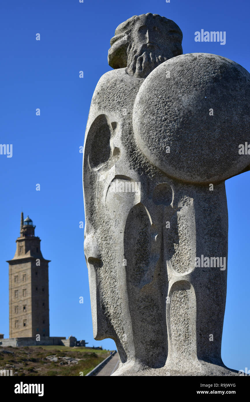 Tower of Hercules and Stone Celtic Warrior. La Coruna, Spain. Roman lighthouse still in use, sunny day. Stock Photo