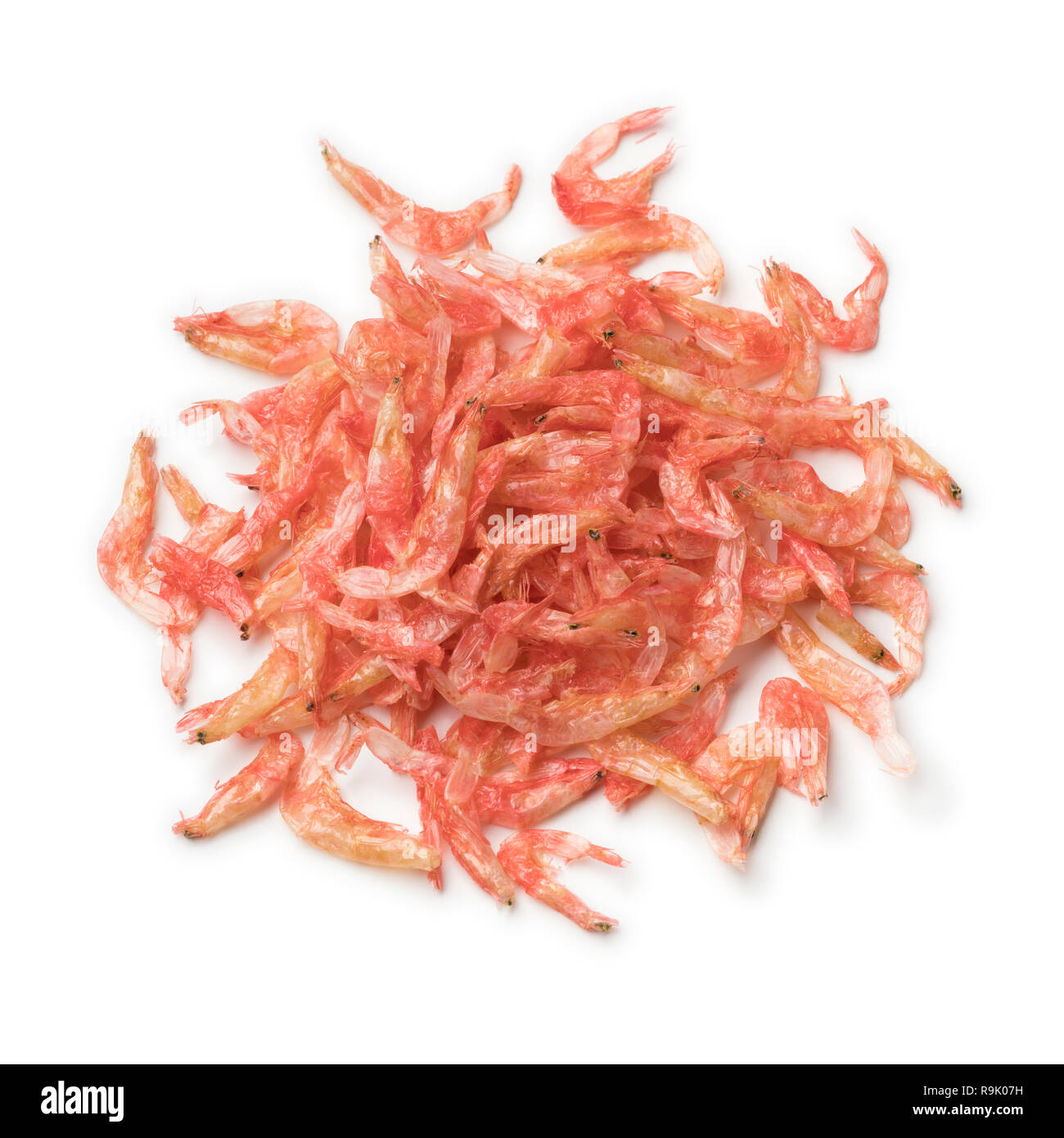 Heap of Japanese Sakuraebi, dried small pink shrimps close up isolated
