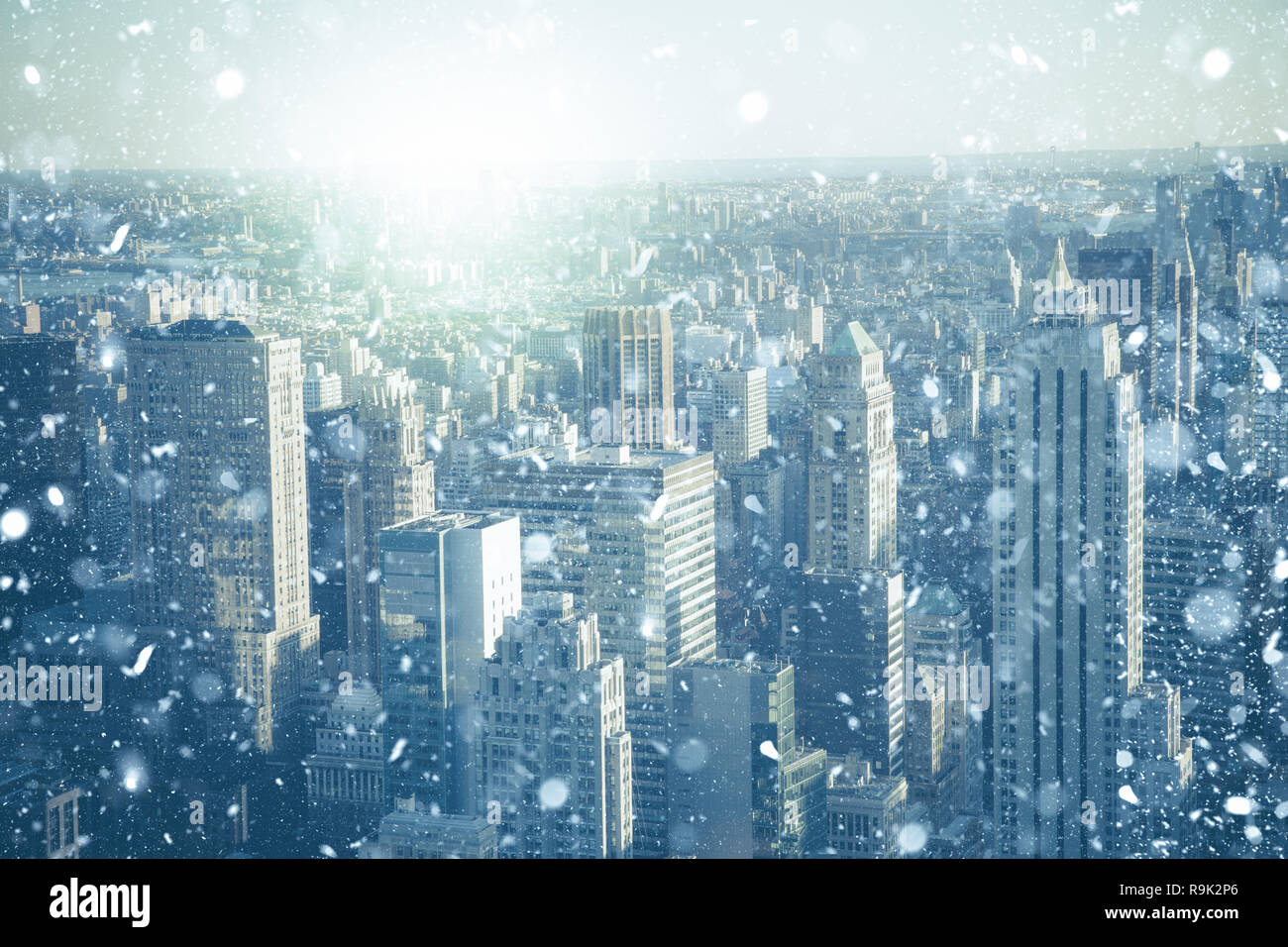 New York City Manhattan skyscraper buildings with snowflakes falling during winter snow storm Stock Photo