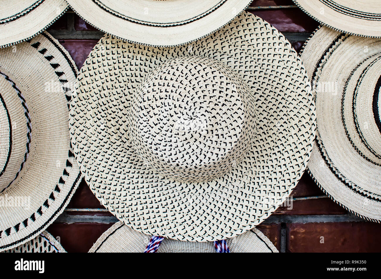 A variety of Panamanian hats for sale. The one in the middle of the picture is known as 'Pepita de Guate' Stock Photo