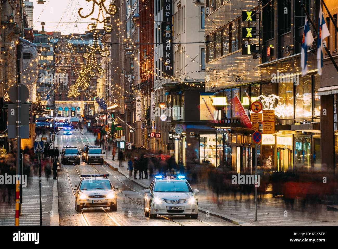 Helsinki, Finland - December 6, 2016: Police Provide Security On Aleksanterinkatu Street. Festive Illuminations View Of Aleksanterinkatu Street During Stock Photo