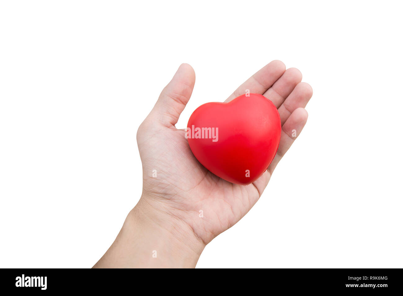 Red heart ball : Stress reliever foam ball the red heart shape on woman hand isolated on white background with clipping path Stock Photo