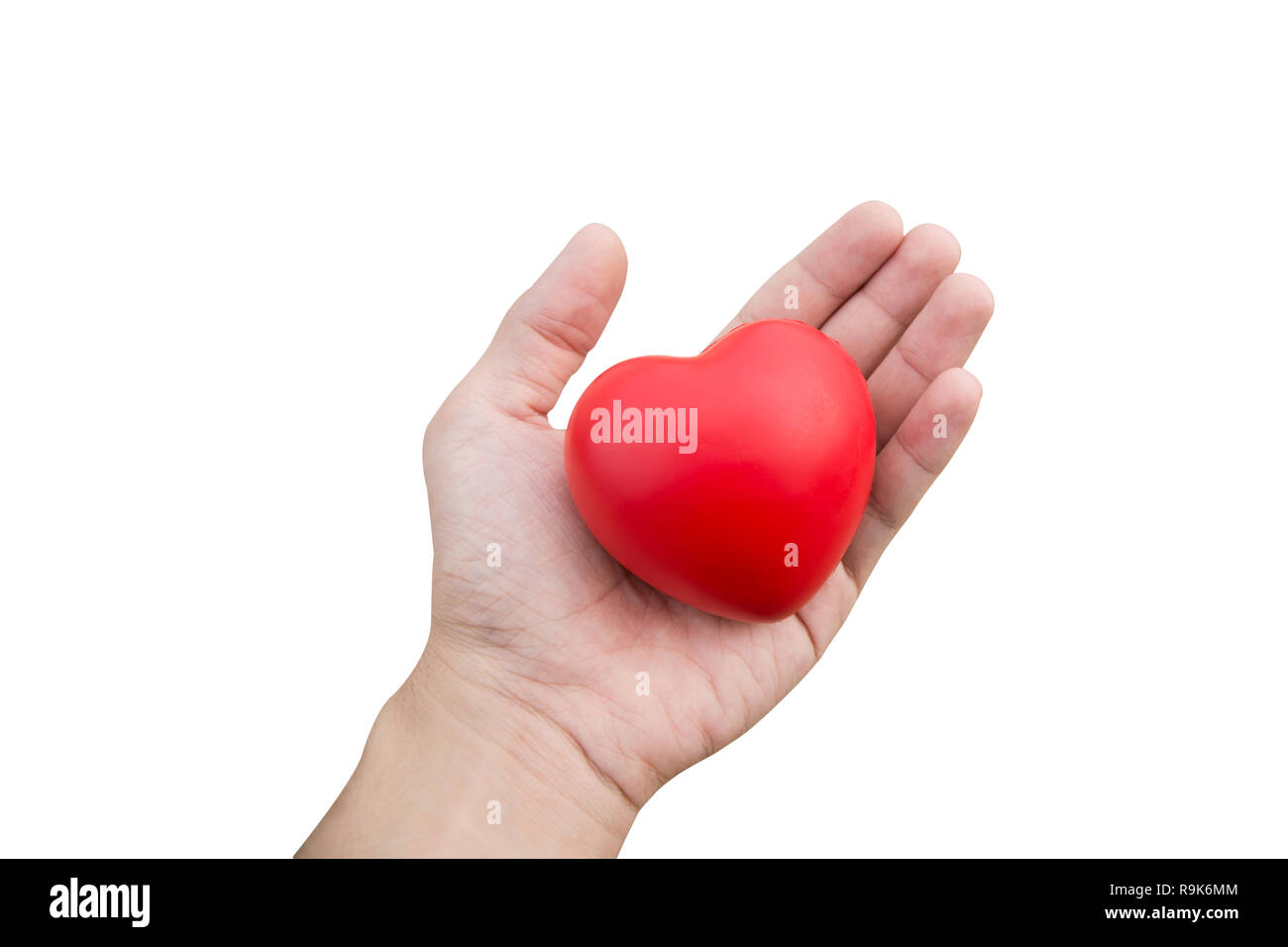 Red heart ball : Stress reliever foam ball the red heart shape on woman hand isolated on white background with clipping path Stock Photo