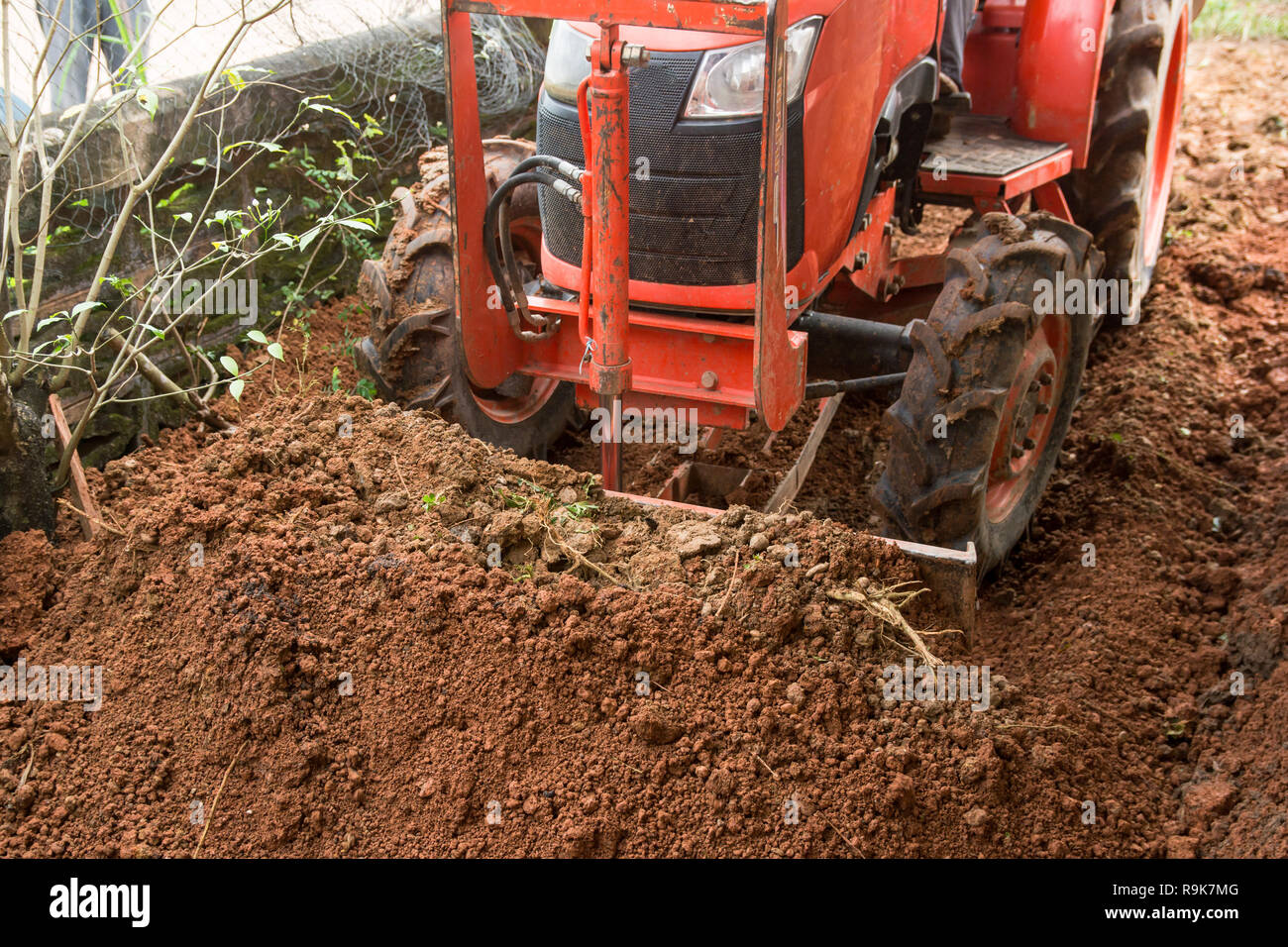 Tractor grader soil working on gravel leveling for Stock Photo