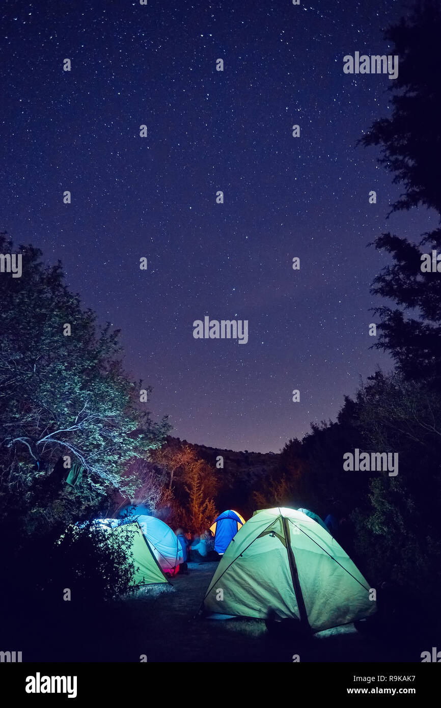 Glowing tent in the mountains under a starry sky Stock Photo - Alamy