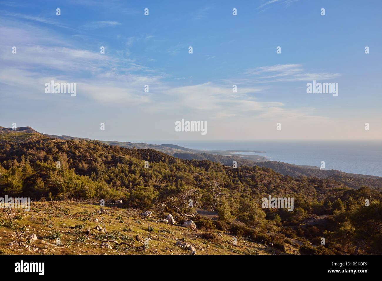 Looking across a campsite towards Chrysohou Bay, Laatchi, Polis and the Troodos Mountains, Akamas Peninsula, Paphos, Cyprus. Stock Photo