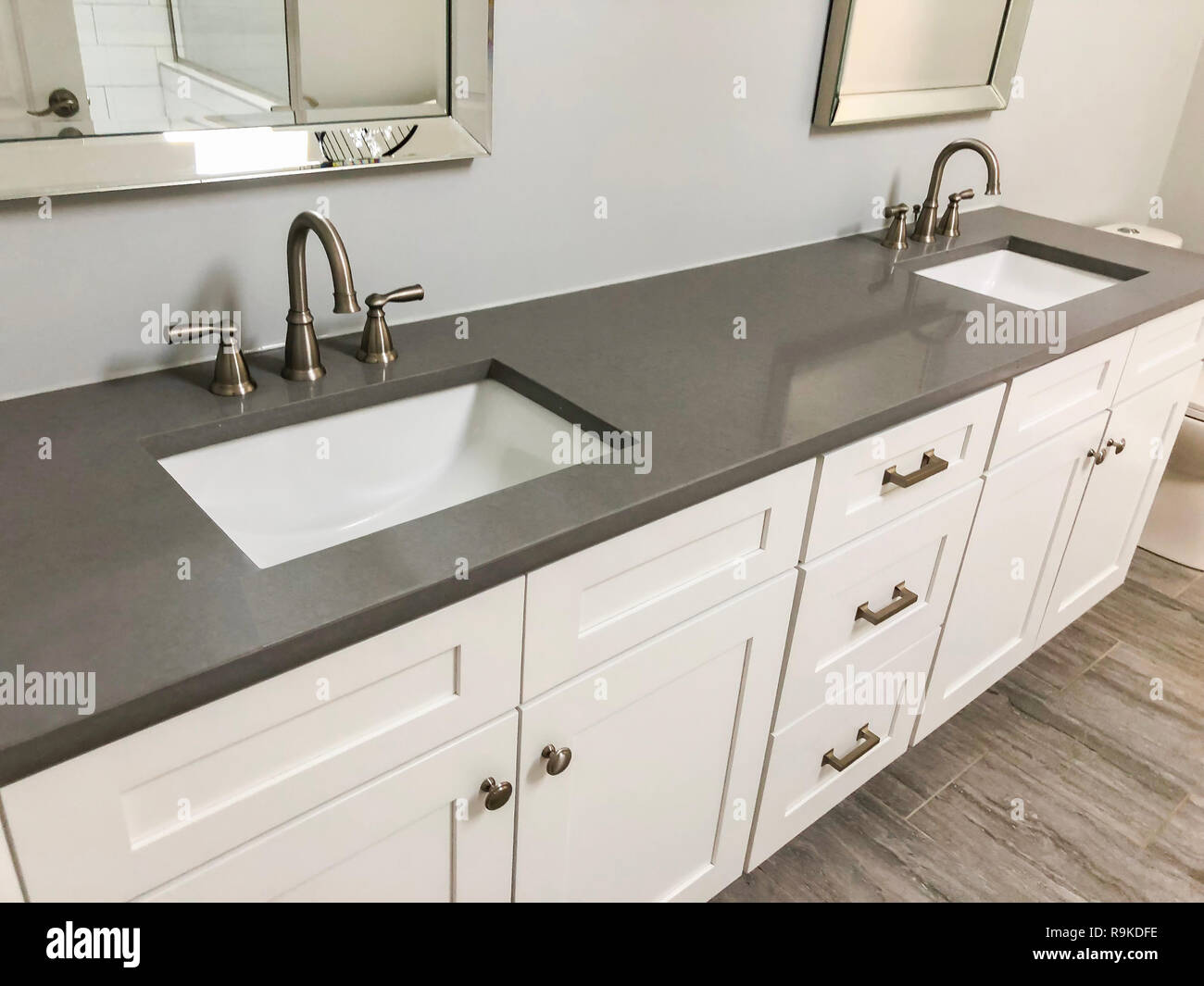 Bathroom interior with modern design of the white and quartz countertop with two sinks