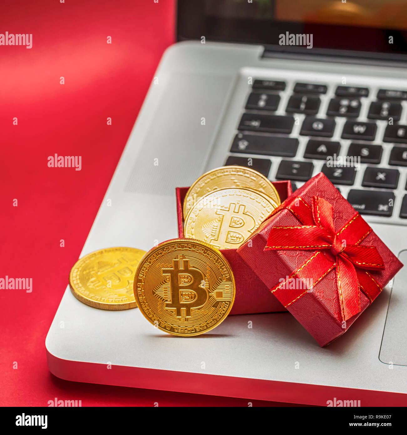 Belgrade, Serbia - Dec 16, 2018 - Bitcoin gift for new year on the laptop - Christmas Cryptocurrency celebration concept. Stock Photo