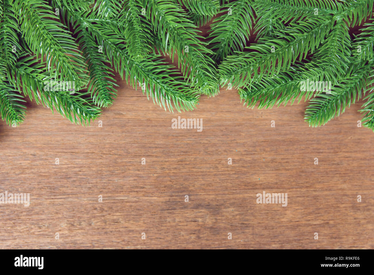Christmas background. Fir tree branches and with decoration on a wooden ...