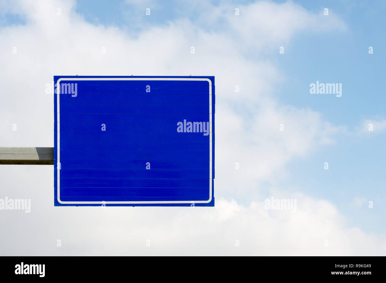 Empty blue road sign on blue sky and white clouds background Stock ...