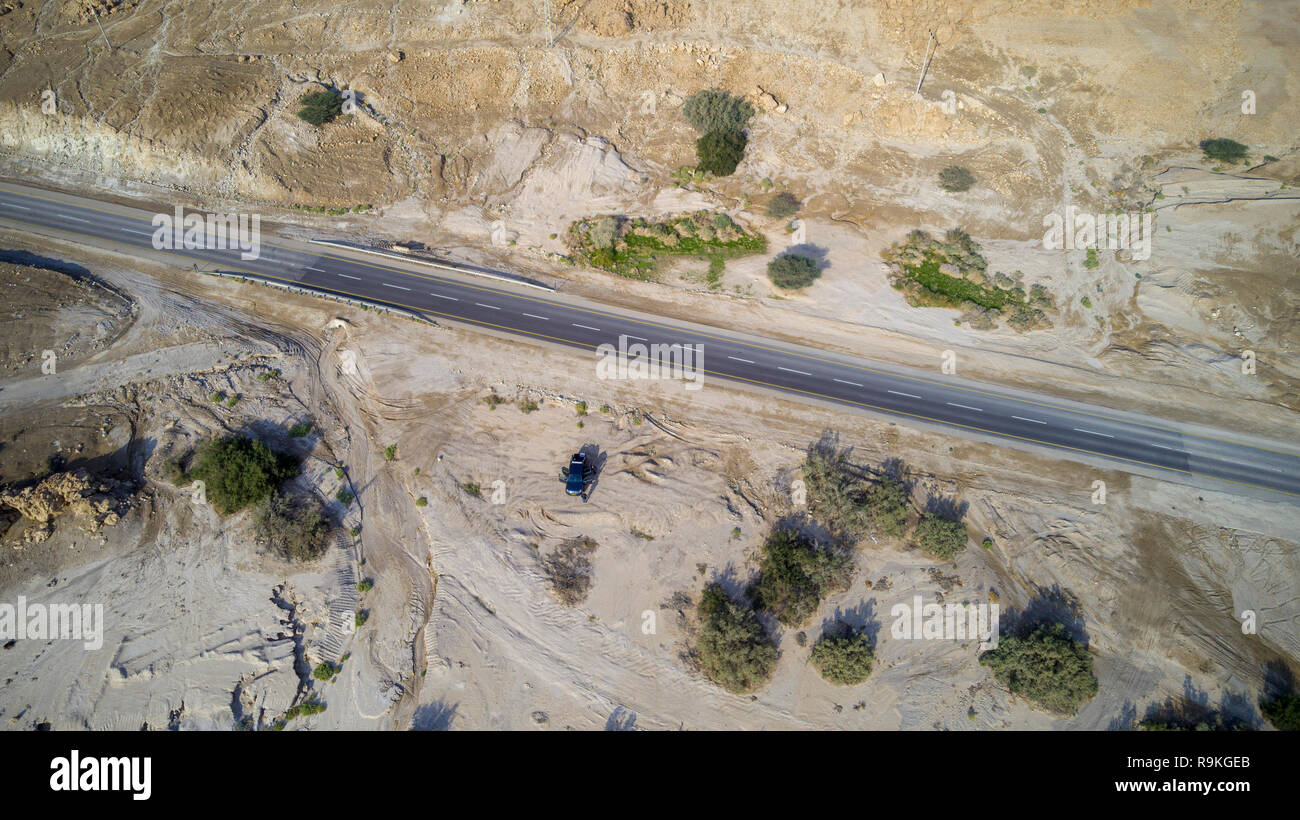 Aerial Photography with a drone. Route 90 that runs along the Dead Sea, Israel. Route 90 is the longest Israeli road, at about 480 kilometres (300 mi) Stock Photo