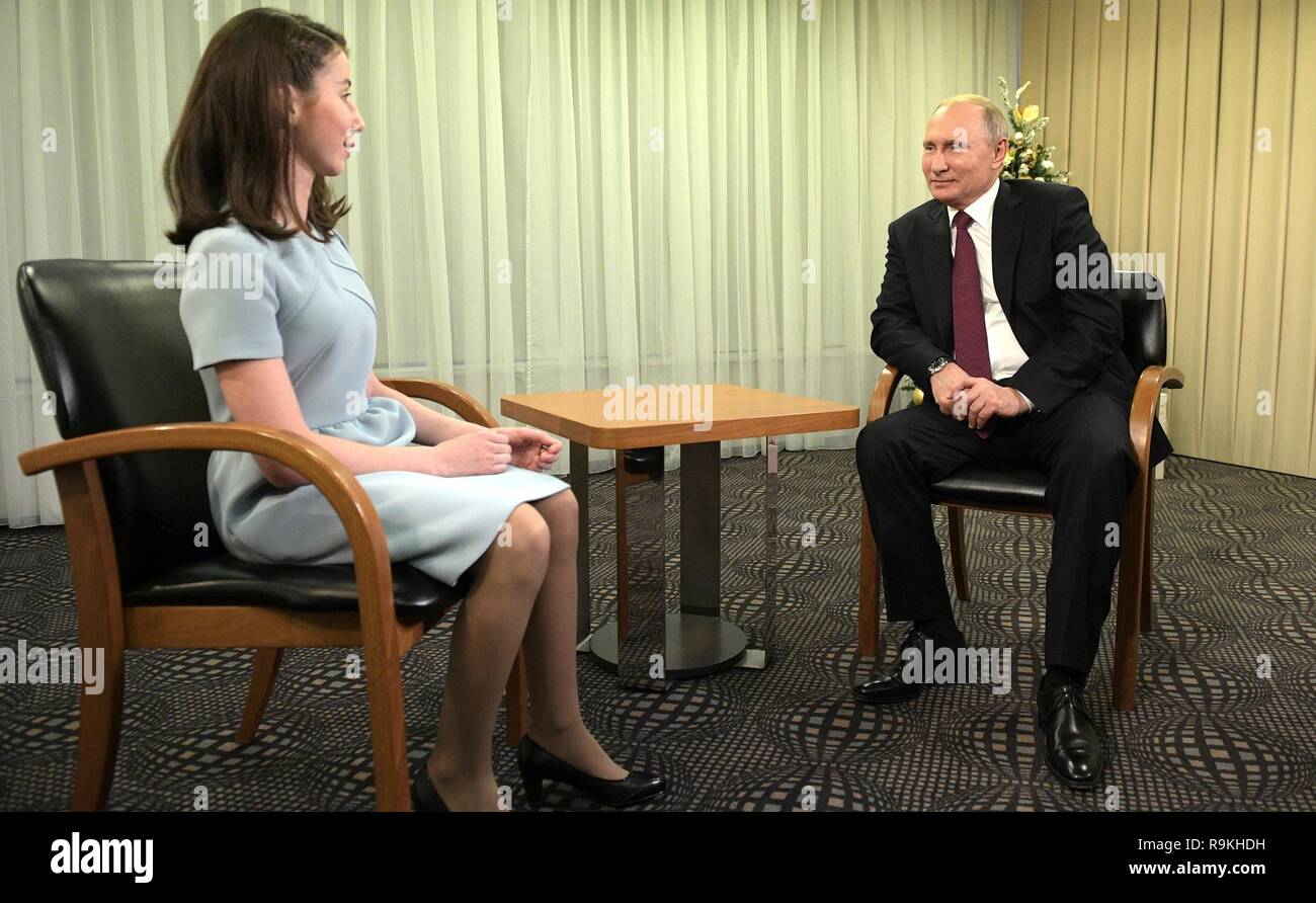 Young blind journalist Regina Parpiyeva, 17, during an exclusive interview with Russian President Vladimir Putin following the annual news conference at the Kremlin December 20, 2018 in Moscow, Russia. Parpiyeva is a participant in the Dream with Me charity project supported by Putin. Stock Photo