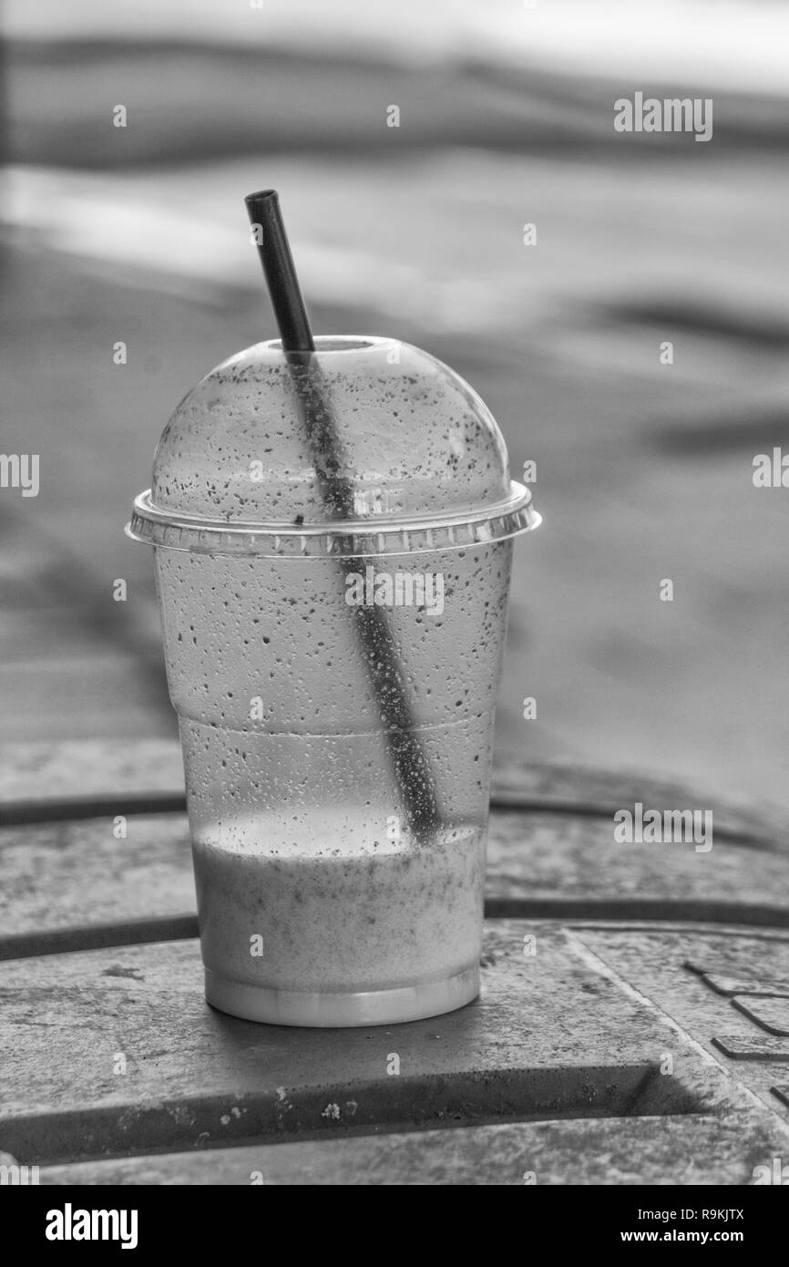 https://c8.alamy.com/comp/R9KJTX/bw-of-ptfe-plastic-smoothie-cup-discarded-in-truro-town-centre-metaphor-plastic-pollution-environmental-pollution-war-on-plastic-waste-R9KJTX.jpg