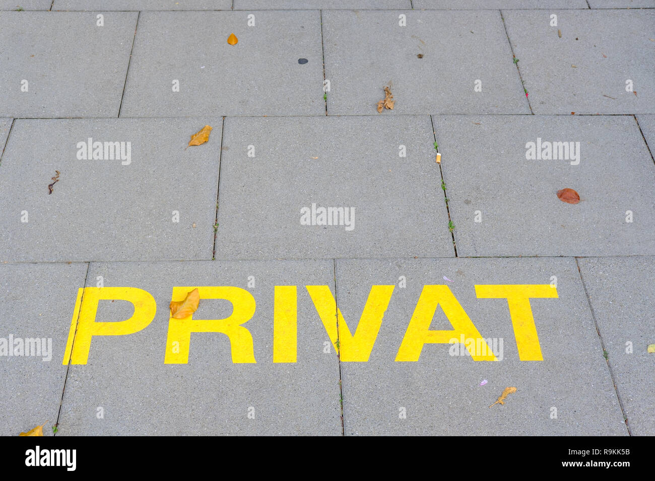 Germanlanguage notice "Privat" (private) painted on the pavement at a