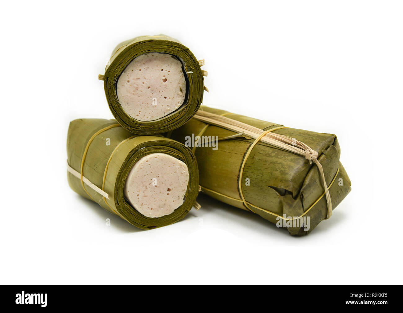 fermented pork sausage with banana leaf wrap isolated on White background / Steamed pork sausage name in thai  Mooyor - vietnamese Pork Sausage Stock Photo