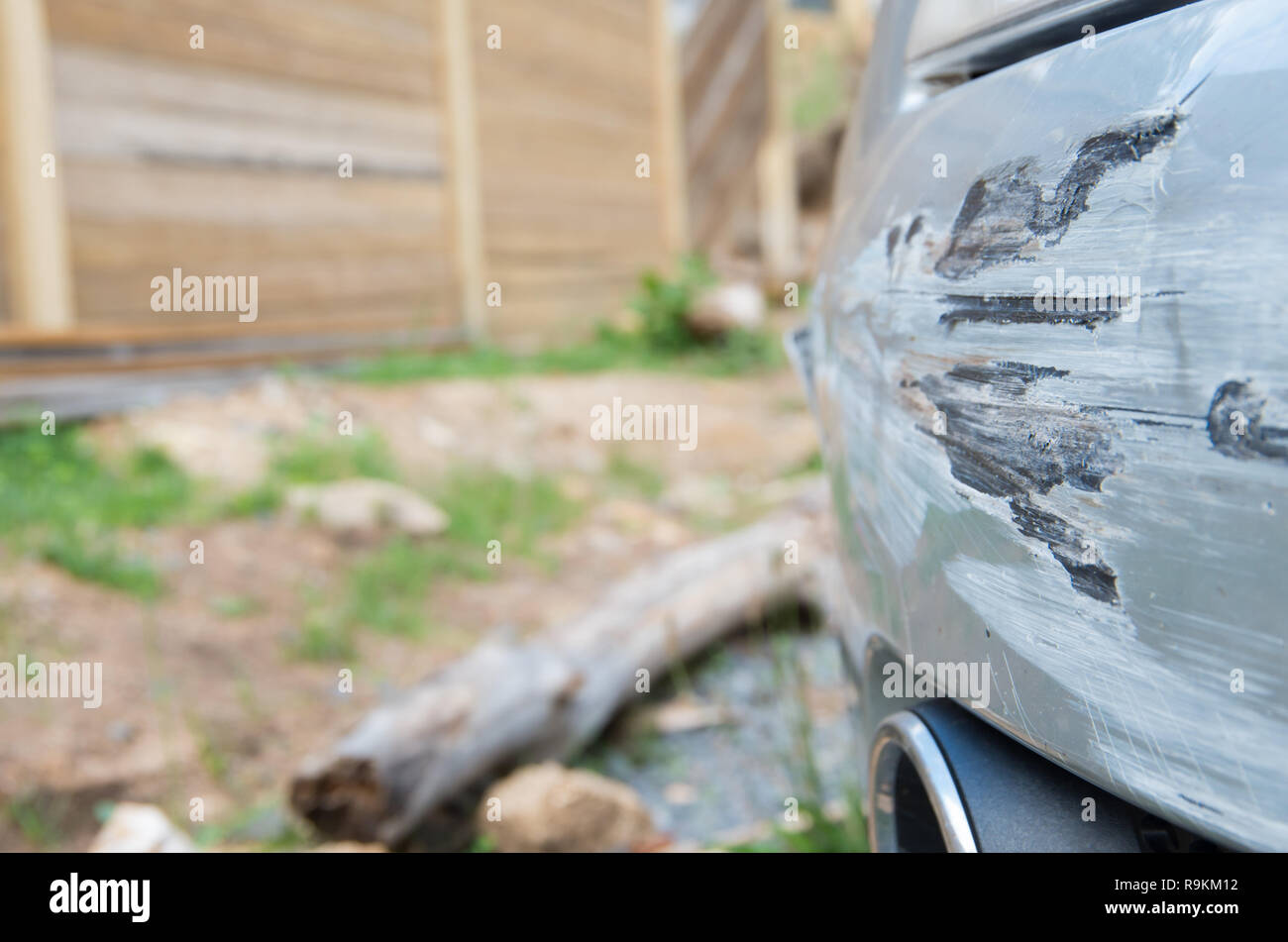 Damaged car bumper after crashing into a guard rail whilst spinning out of control Stock Photo