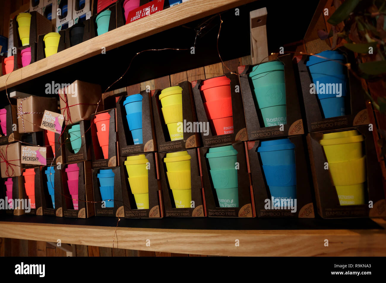 General view of recycled coffee cups for sale at Boston Tea Party Restaurant in Chichester, West Sussex, UK. Stock Photo