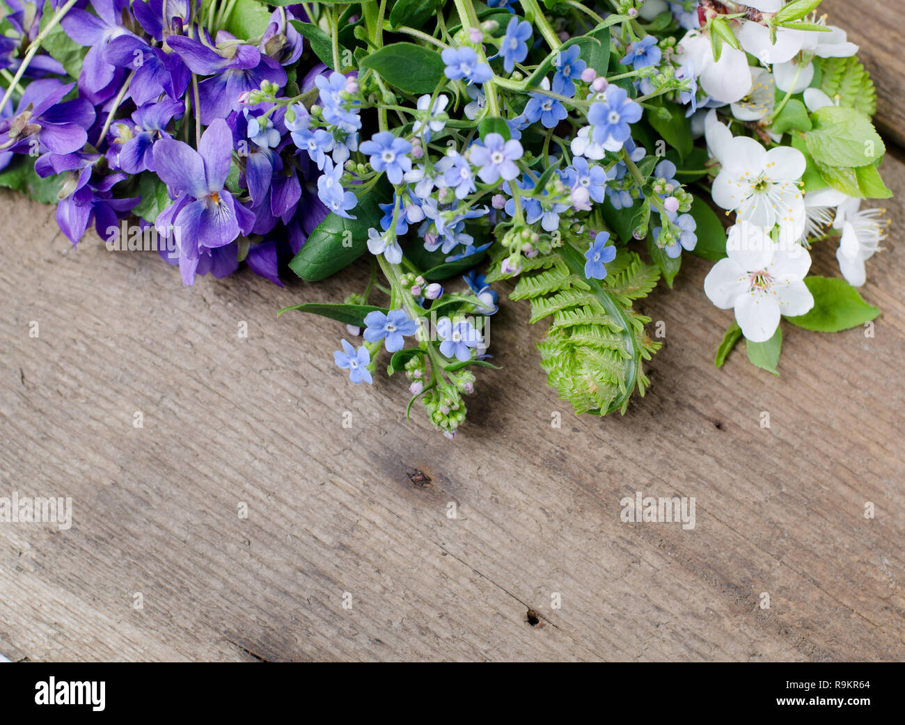 Spring Bouquet With Violets And Forget Me Not Flowers On A Wooden Background With Space For Text Stock Photo Alamy