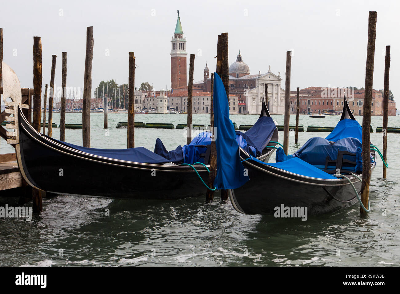 Venice. Rainy weather. Italy. Tied up gondolas Stock Photo