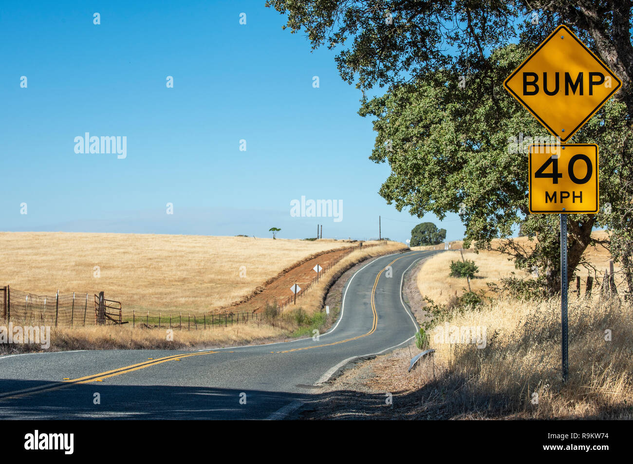 Wavy California country road with sign sign Stock Photo