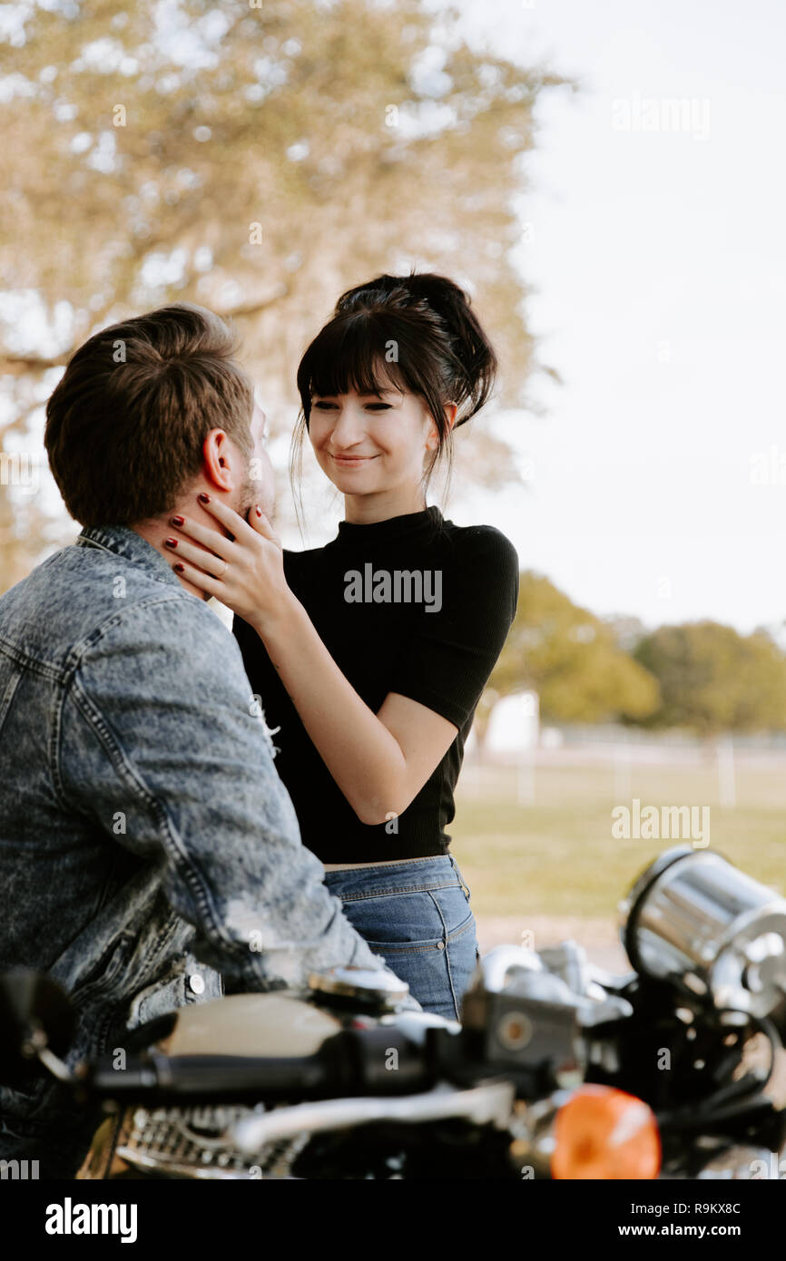 Loving Adorable Portrait Of Two Attractive Good Looking Young Adult Modern Fashionable People Guy Girl Couple On Classic Green Motorcycle Kissing Stock Photo Alamy