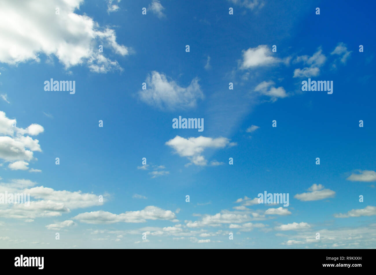 light cumulus clouds in the blue sky Stock Photo - Alamy