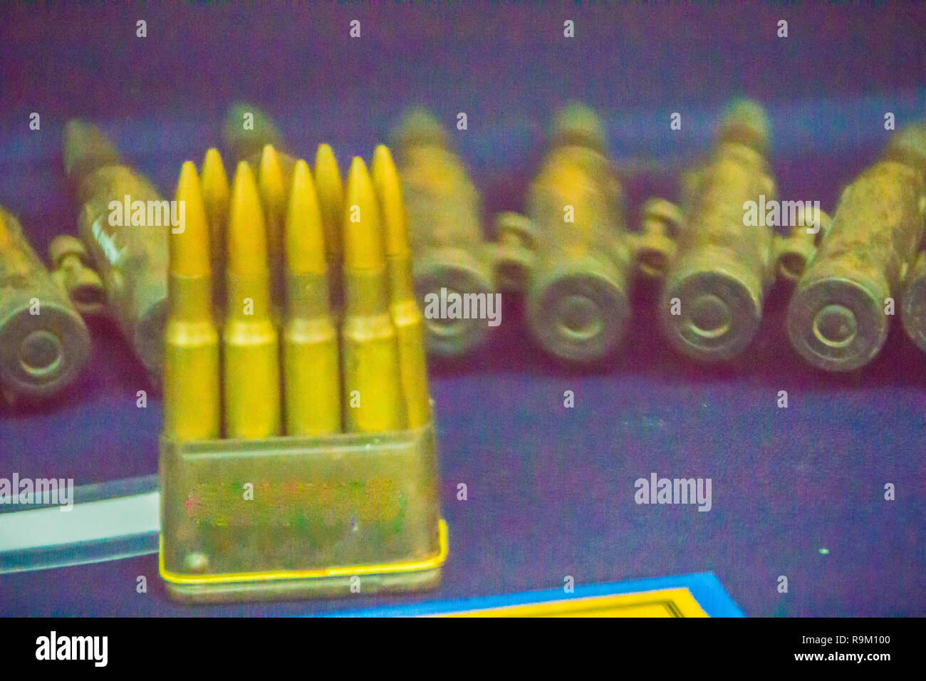 Old anti-aircraft 12.7 mm. bullets for machine gun. Bullets in ammunition belt for machine gun. Stock Photo