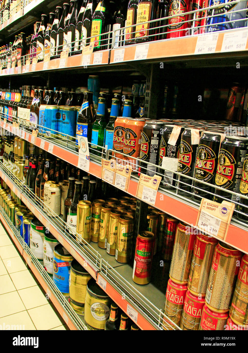 Alcoholic drinks on shelves of supermarket. Alcohol drink market ...