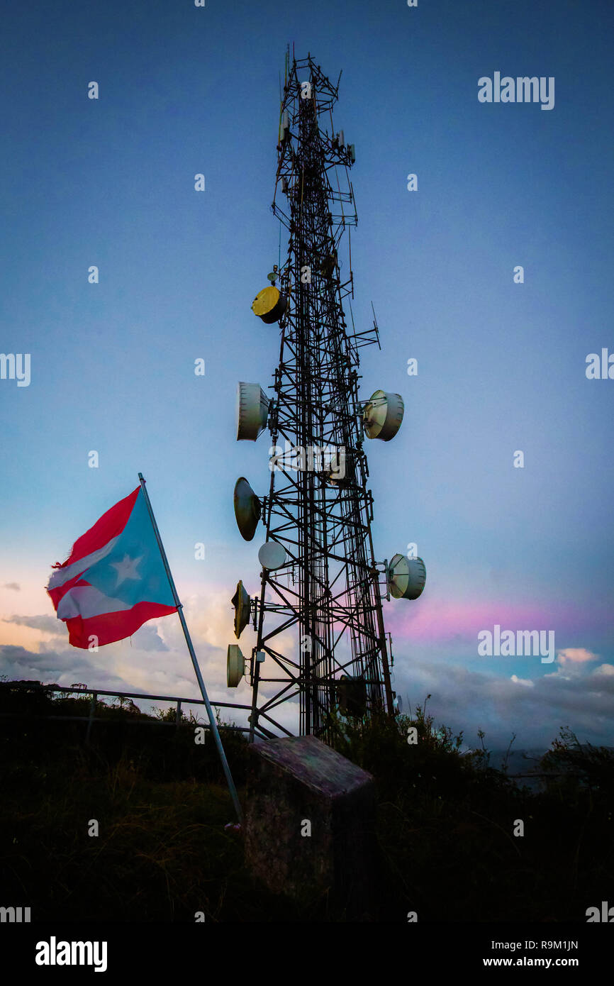 Telecommunication transmitting tower at dawn on top mountain Stock Photo