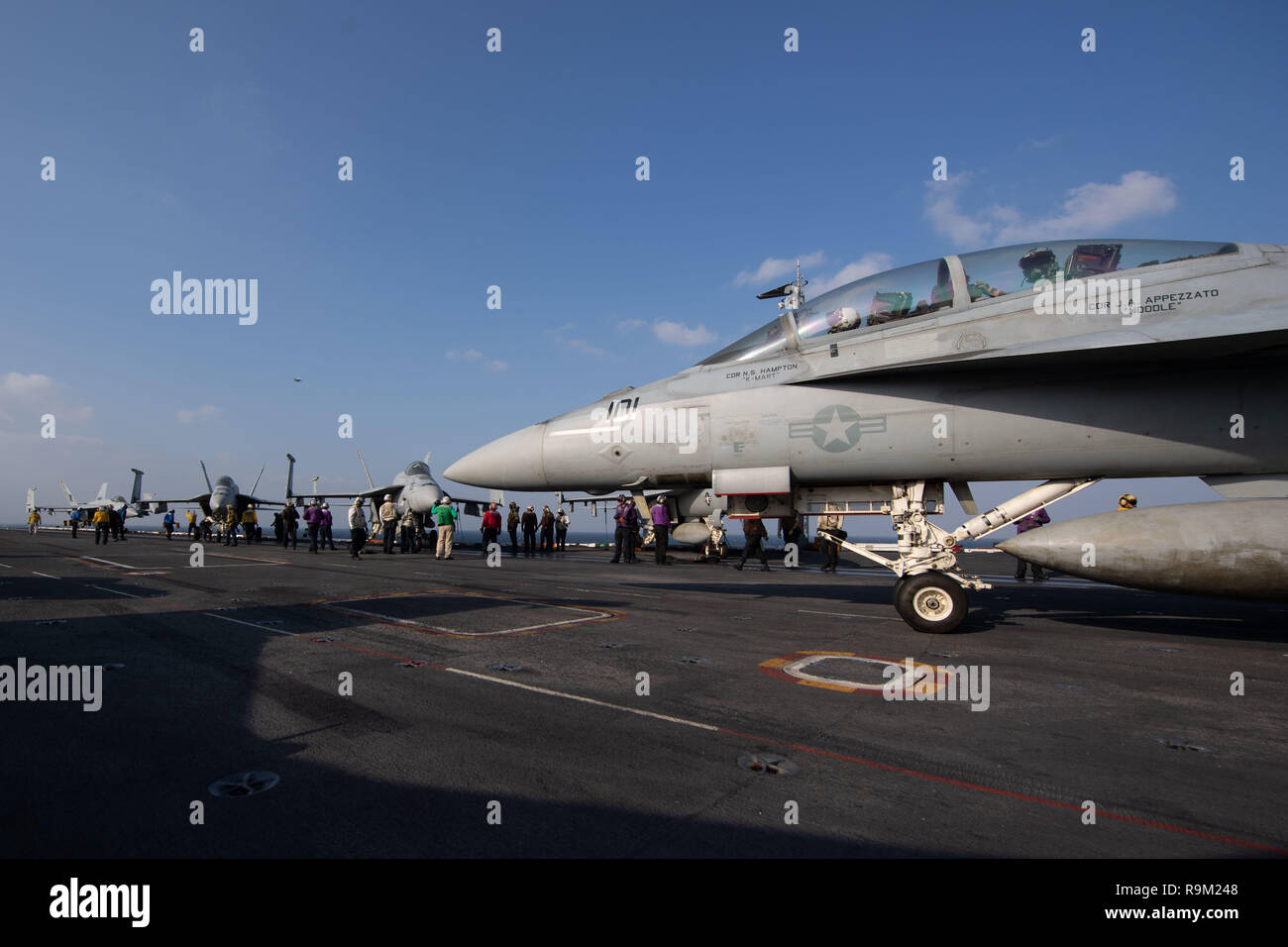 An F/A-18F Super Hornet, assigned to Strike Fighter Squadron (VFA) 41, taxies on the flight deck of the aircraft carrier USS John C. Stennis (CVN 74) in the Arabian Gulf, Dec. 22, 2018. The John C. Stennis Carrier Strike Group is deployed to the U.S. 5th Fleet area of operations in support of naval operations to ensure maritime stability and security in the Central Region, connecting the Mediterranean and the Pacific through the western Indian Ocean and three strategic choke points. (U.S. Navy photo by Mass Communications Specialist 3rd Class Grant G. Grady) Stock Photo